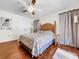 Spacious bedroom featuring wood floors and double doors to closet at 209 Santa Rosa Dr, Winter Haven, FL 33884