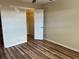 Bedroom with wood-look floors and a large closet at 1039 Medinah Dr, Winter Haven, FL 33884