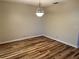 Bright dining area with wood-look floors and a chandelier at 1039 Medinah Dr, Winter Haven, FL 33884