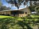 Rear exterior view of house with screened porch at 1039 Medinah Dr, Winter Haven, FL 33884