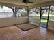 Screened porch overlooking tennis courts at 1039 Medinah Dr, Winter Haven, FL 33884