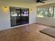 Bright screened porch with tiled floor and ceiling fan at 1039 Medinah Dr, Winter Haven, FL 33884