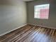 Bedroom with wood-look flooring and a window at 1039 Medinah Dr, Winter Haven, FL 33884