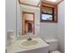 Clean and simple bathroom with a single sink and toilet at 222 Okaloosa Dr, Winter Haven, FL 33884