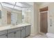 Bathroom with shower, vanity, and a large mirror at 222 Okaloosa Dr, Winter Haven, FL 33884