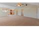 Open concept living room with views of the entryway and sunroom at 222 Okaloosa Dr, Winter Haven, FL 33884