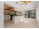 Eat-in kitchen with vaulted ceiling and breakfast bar at 222 Okaloosa Dr, Winter Haven, FL 33884