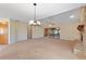 Bright and spacious living room with high ceilings and a chandelier at 222 Okaloosa Dr, Winter Haven, FL 33884