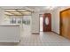 Bright and airy entryway with tile flooring and wood door at 222 Okaloosa Dr, Winter Haven, FL 33884