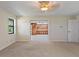 Bedroom with view into adjacent room and access to the hallway at 222 Okaloosa Dr, Winter Haven, FL 33884