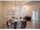 Modern dining room with a metal table and brown leather chairs at 1274 Zambrana Ct, Winter Haven, FL 33884