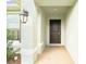 Inviting front entrance with a dark brown door and a charming autumnal wreath at 1274 Zambrana Ct, Winter Haven, FL 33884