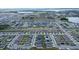 Aerial view of a large community with houses and lakes at 1274 Zambrana Ct, Winter Haven, FL 33884