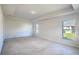 Spacious main bedroom with carpeted floors and windows at 1274 Zambrana Ct, Winter Haven, FL 33884
