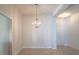 Bright dining room features tile floors and modern chandelier at 1274 Zambrana Ct, Winter Haven, FL 33884