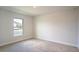 Bright bedroom with carpeted floor and large window at 1274 Zambrana Ct, Winter Haven, FL 33884