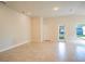 Spacious Gathering room with tile floors and access to backyard at 1274 Zambrana Ct, Winter Haven, FL 33884