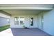 Covered back patio with access door to the house and additional glass sliding door at 1274 Zambrana Ct, Winter Haven, FL 33884