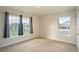 Bedroom with carpeted floor and two windows at 1274 Zambrana Ct, Winter Haven, FL 33884