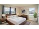 Bright bedroom with wood platform bed and ample natural light at 1274 Zambrana Ct, Winter Haven, FL 33884