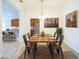 Rustic dining room with a reclaimed wood table and metal chairs at 1274 Zambrana Ct, Winter Haven, FL 33884