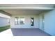 Covered back patio with access door to the house and additional glass sliding door at 1274 Zambrana Ct, Winter Haven, FL 33884