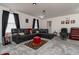 Home theater room features sectional sofa and a large screen at 940 Waterville Dr, Auburndale, FL 33823