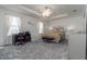 Bright main bedroom with king bed, desk and sitting area at 940 Waterville Dr, Auburndale, FL 33823