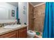 Clean bathroom, featuring a tiled shower and updated vanity at 940 Waterville Dr, Auburndale, FL 33823