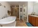Relaxing bathroom with a large soaking tub and walk-in shower at 940 Waterville Dr, Auburndale, FL 33823