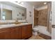 Clean bathroom with double vanity and shower/tub combo at 940 Waterville Dr, Auburndale, FL 33823