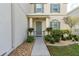 Inviting front entry with landscaping and a walkway at 940 Waterville Dr, Auburndale, FL 33823