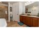 Bathroom boasts double vanity, soaking tub and walk-in shower at 940 Waterville Dr, Auburndale, FL 33823