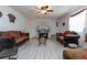 Spacious living room with two sofas, coffee table, and TV at 940 Waterville Dr, Auburndale, FL 33823