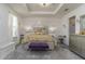 Elegant main bedroom with a king-size bed and stylish decor at 940 Waterville Dr, Auburndale, FL 33823