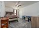 Cozy bedroom with a king-size bed and game table at 940 Waterville Dr, Auburndale, FL 33823