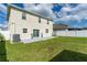 Spacious backyard with grassy lawn and a patio at 940 Waterville Dr, Auburndale, FL 33823