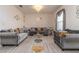 Bright living room with comfy sofas and a chandelier at 940 Waterville Dr, Auburndale, FL 33823
