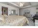 Spacious main bedroom with king-size bed and en-suite bathroom at 940 Waterville Dr, Auburndale, FL 33823