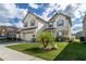 Two-story house with a palm tree and well-maintained lawn at 940 Waterville Dr, Auburndale, FL 33823