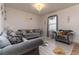 Bright living room with comfy sofas and a chandelier at 940 Waterville Dr, Auburndale, FL 33823