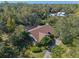 Aerial view of home highlighting its roofline and landscaping at 123 Old Spanish Way, Winter Haven, FL 33884