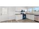 Bright kitchen with white cabinets, granite countertops, and stainless steel appliances at 1800 4Th Nw St, Winter Haven, FL 33881