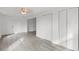 Simple bedroom with hardwood floors and neutral walls at 1800 4Th Nw St, Winter Haven, FL 33881