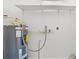 Laundry area with water heater and shelving at 1800 4Th Nw St, Winter Haven, FL 33881