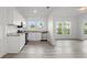 Open concept kitchen features white shaker cabinets and granite countertops at 1800 4Th Nw St, Winter Haven, FL 33881
