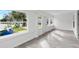 Sunroom featuring large windows, wood-look flooring, and exterior views at 1800 4Th Nw St, Winter Haven, FL 33881