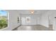 Spacious living room with hardwood floors and an abundance of natural light at 1800 4Th Nw St, Winter Haven, FL 33881