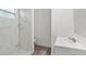 Clean bathroom with marble-look shower and white vanity at 1800 4Th Nw St, Winter Haven, FL 33881