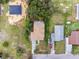 Aerial view of a house and surrounding neighborhood at 1800 4Th Nw St, Winter Haven, FL 33881